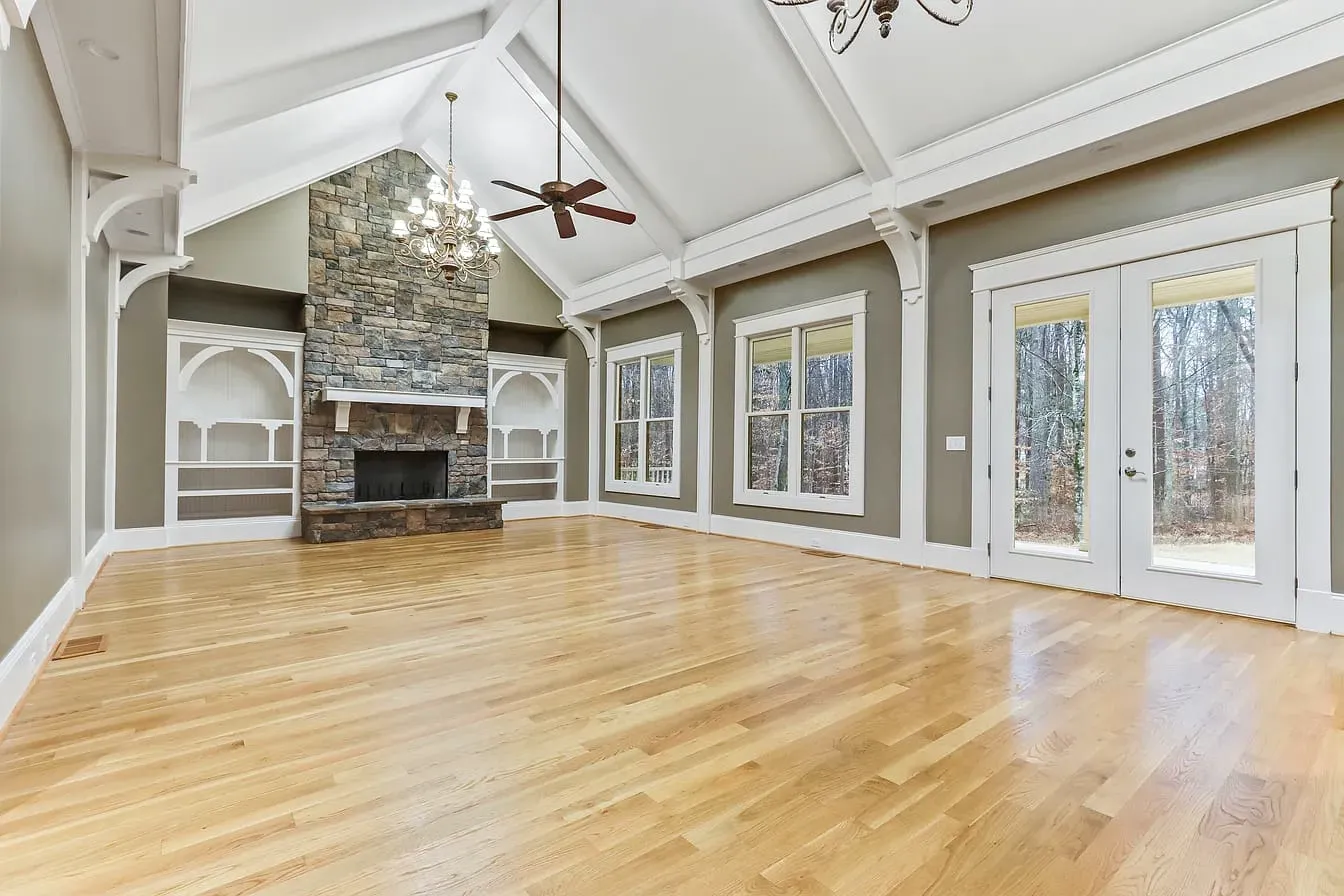 Open living room with stone fireplace