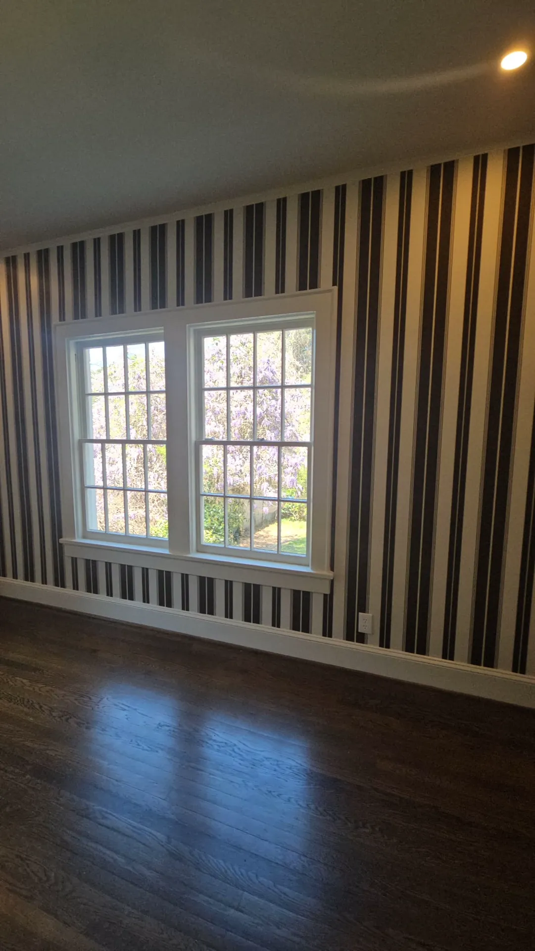 Room with designer striped wallpaper