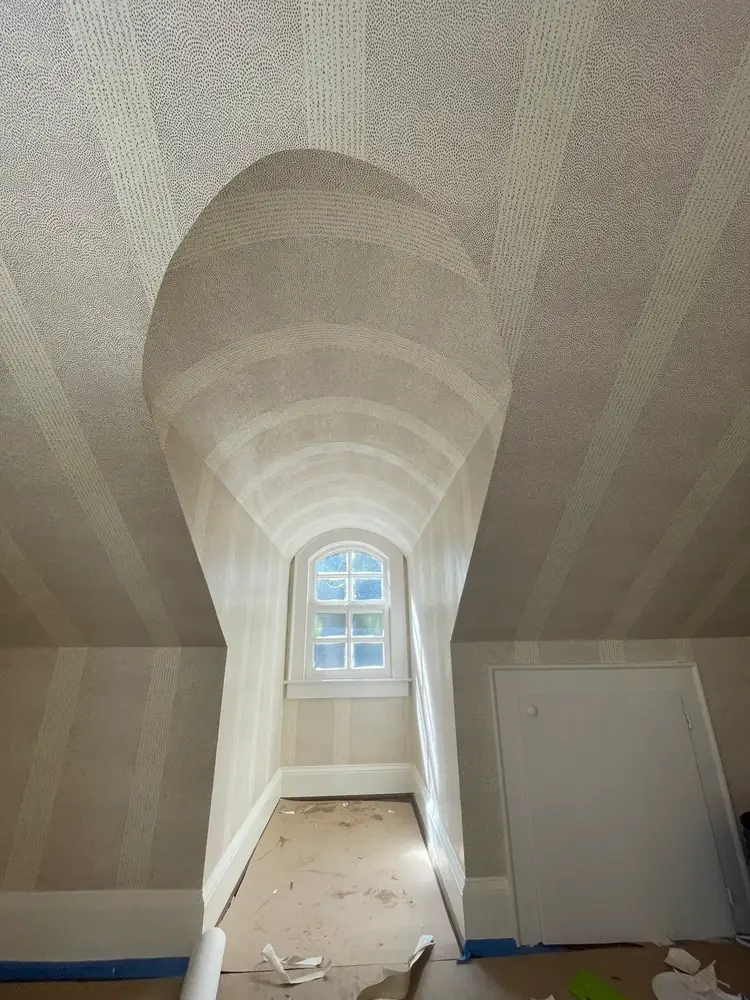Staircase vault with wallpaper