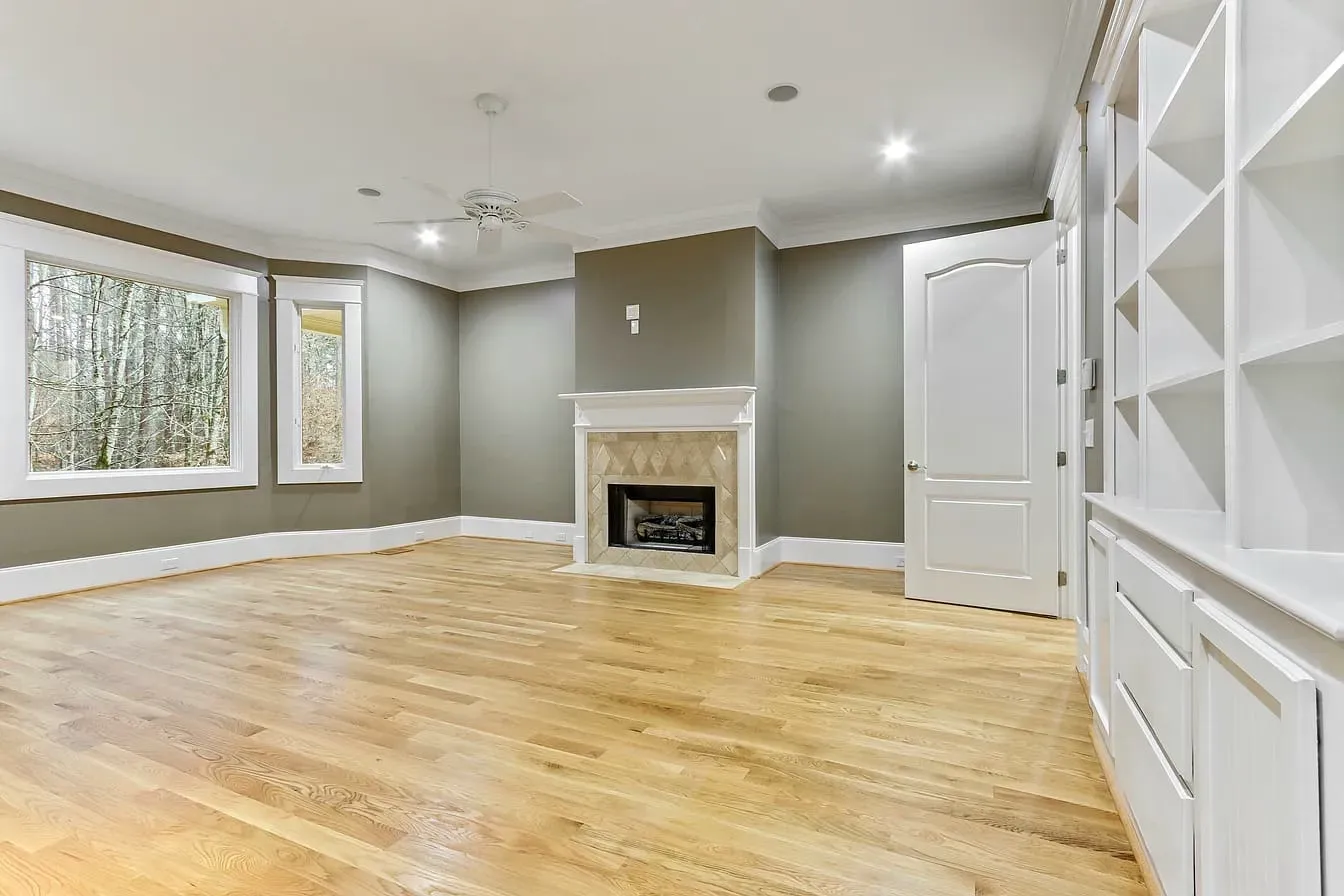 Living room with built-in shelving and fireplace